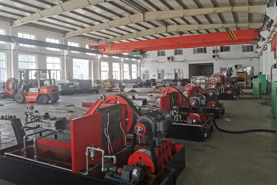 Technician assembling and calibrating a cold heading machine